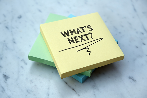 A post-it note with what's next written on it