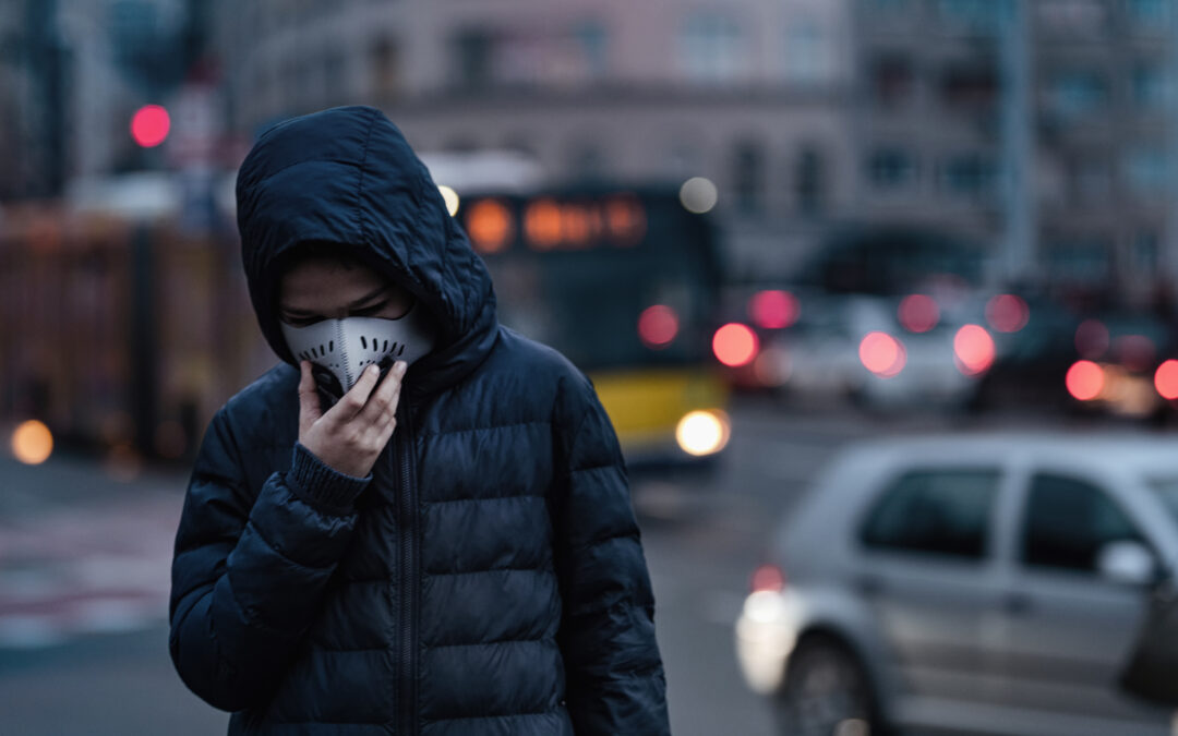 Boy on the City Street Wearing Anti-Pollution Mask